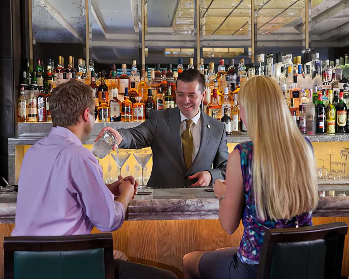 Jumeirah_Carlton_Tower_-_Rib_Room_Couple_at_Bar